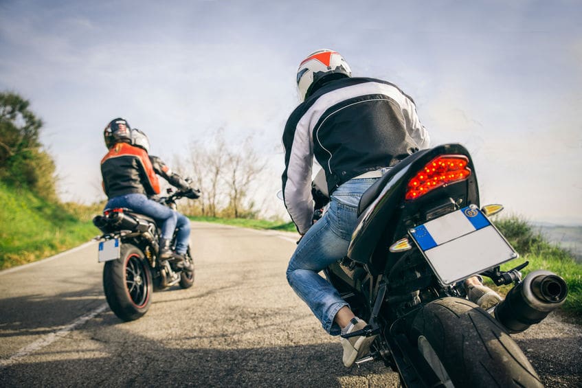 Two motorbikes driving in the nature